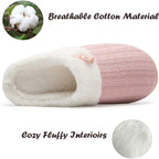 Pair of waterproof knitted slippers in light pink color displayed on a clean background.